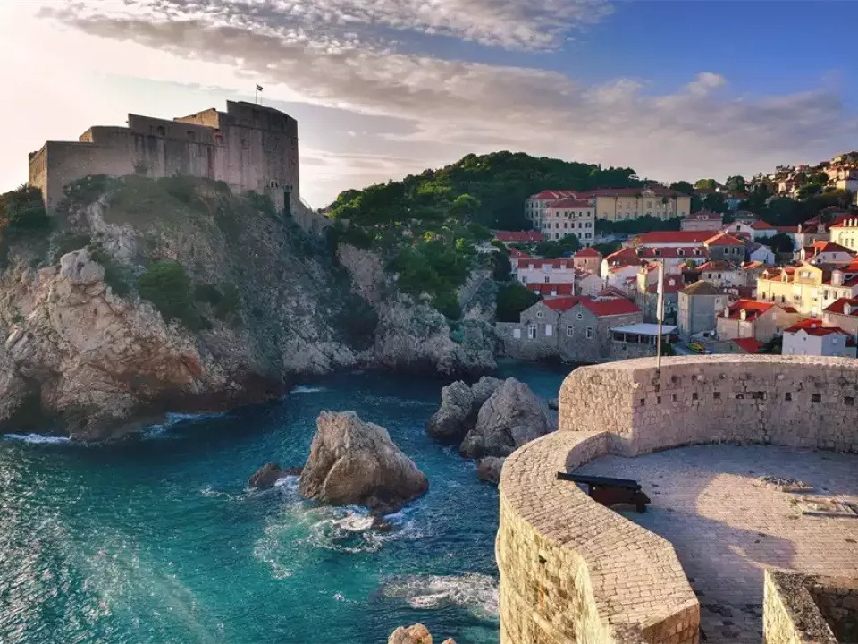 Two glasses of wine with view of Fortress Lovrijenac from Dubrovnik city walls