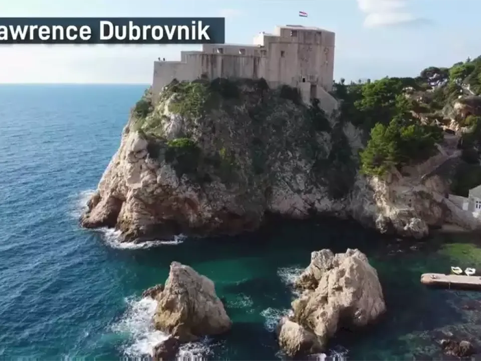 Two glasses of wine with view of Fortress Lovrijenac from Dubrovnik city walls