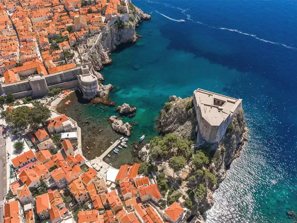 Two glasses of wine with view of Fortress Lovrijenac from Dubrovnik city walls