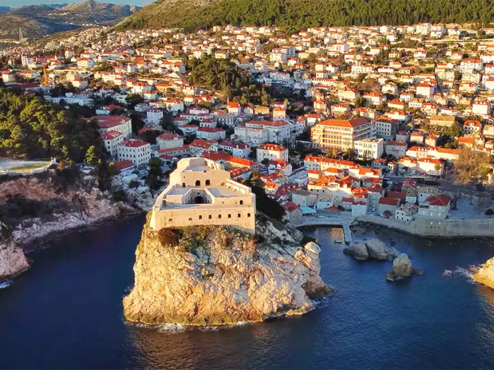Two glasses of wine with view of Fortress Lovrijenac from Dubrovnik city walls