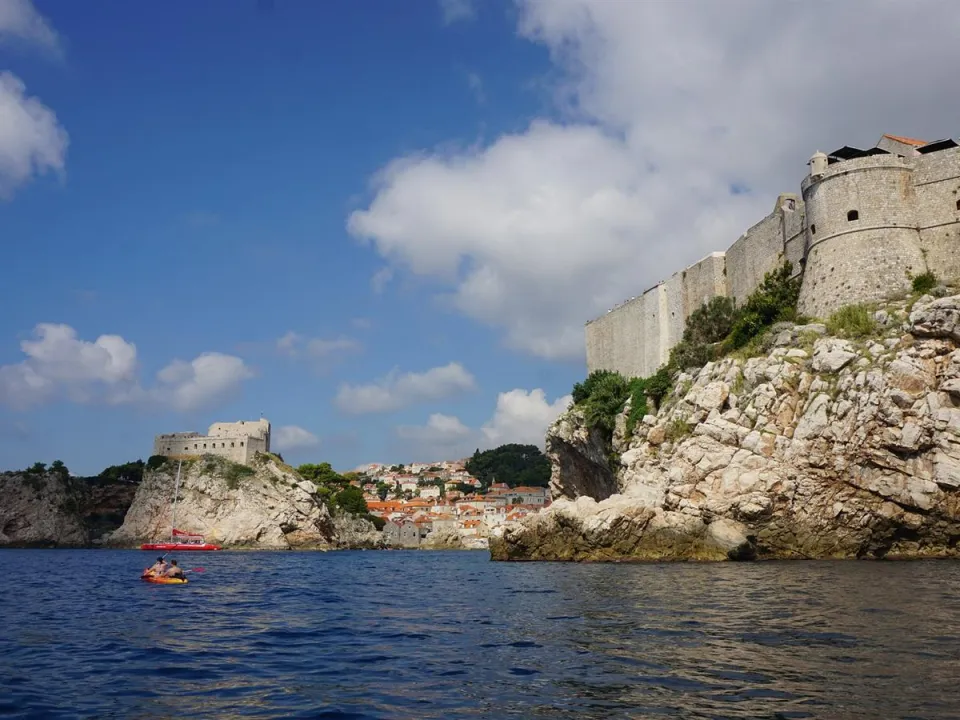 Two glasses of wine with view of Fortress Lovrijenac from Dubrovnik city walls
