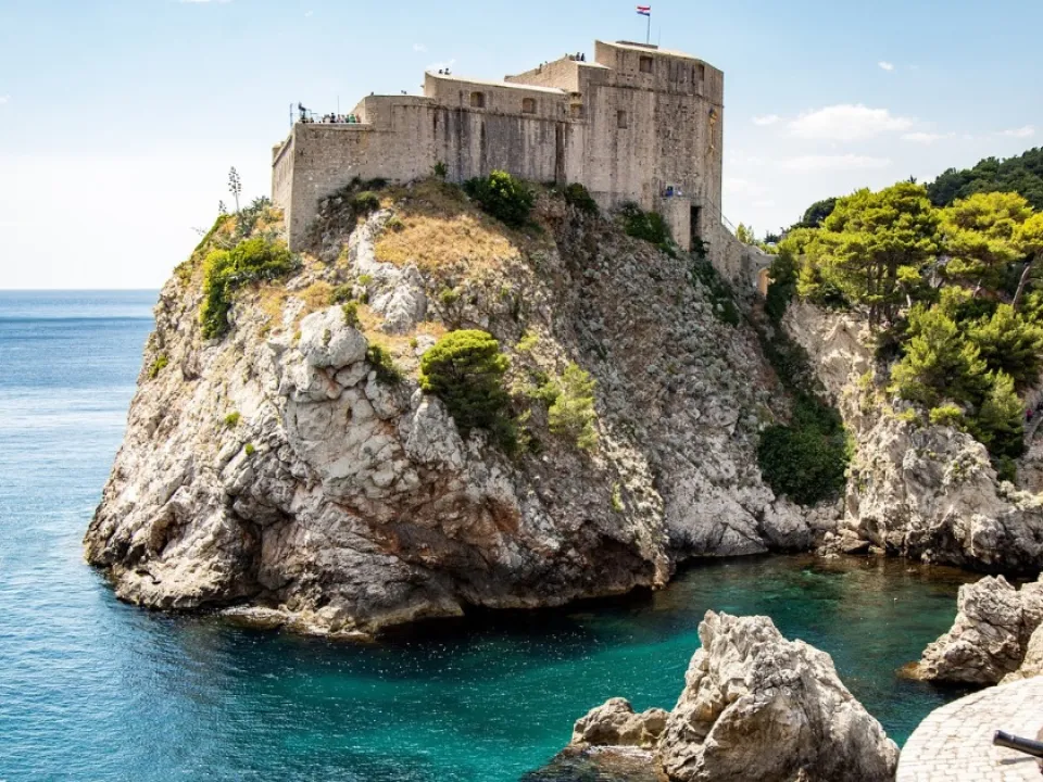 Two glasses of wine with view of Fortress Lovrijenac from Dubrovnik city walls
