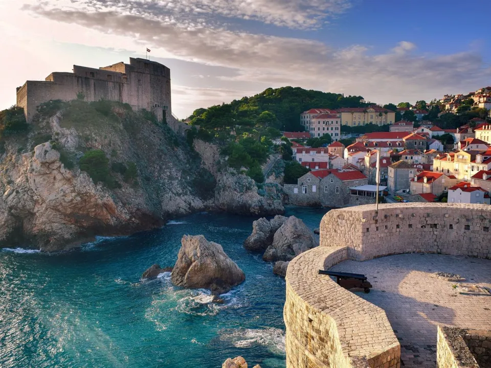 Two glasses of wine with view of Fortress Lovrijenac from Dubrovnik city walls