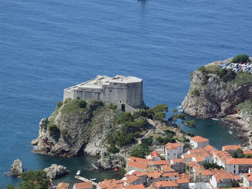 Two glasses of wine with view of Fortress Lovrijenac from Dubrovnik city walls
